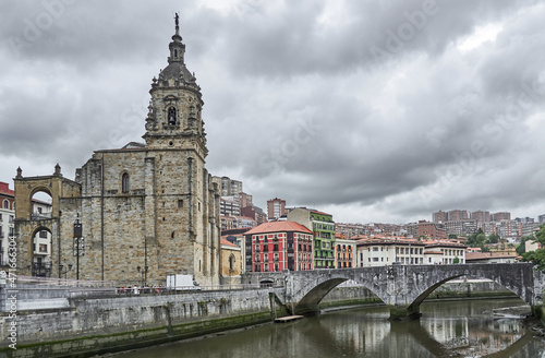 Church and stone bridge next to the Bilbao estuary