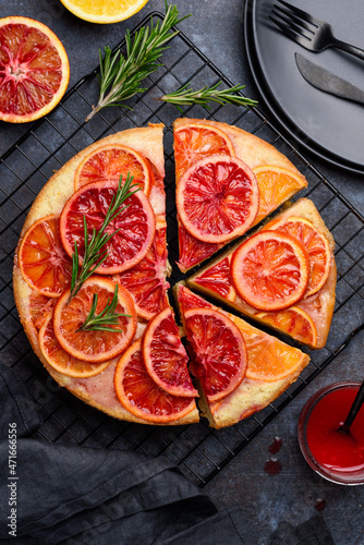 Blood orange upside down cake or pie on a blue background. Fruit citrus baking. Top view