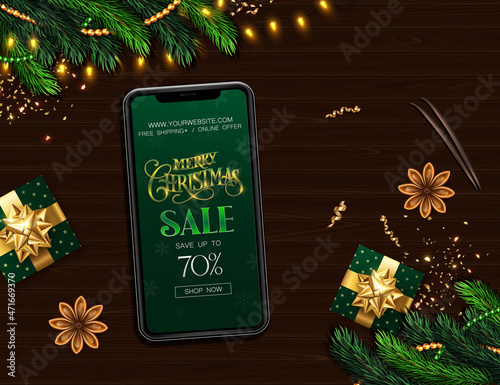 Christmas Sale banner-mockup. Smartphone on a wooden background with gifts, streamers, cocoa and cinnamon.