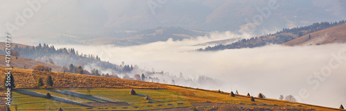 Obraz na płótnie Fall landscape, foggy sunrise in Carpathians. Majestic misty scenery, valley, village, tonal perspective w salonie