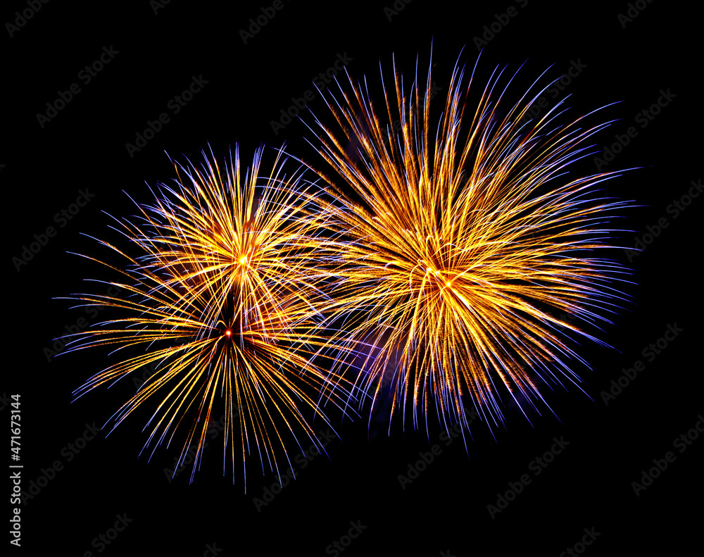 Gold and blue fireworks, isolated on a black background