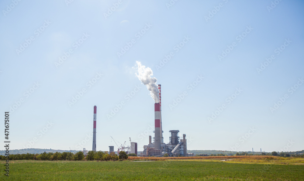 Smoke from industry chimney over sky 