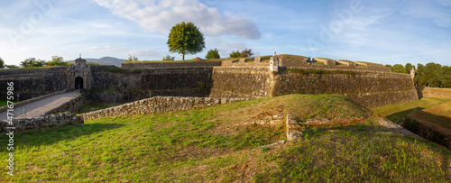 Gate and defensive walls of the city of Valença in Portugal  photo