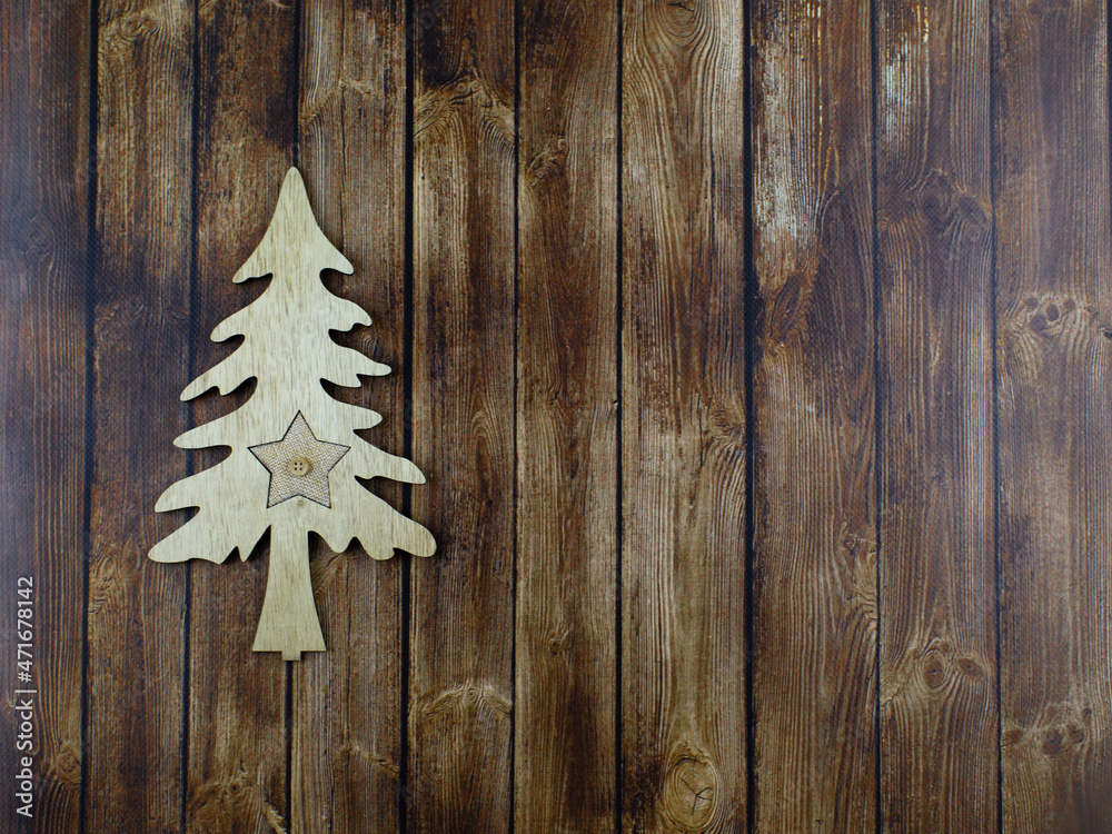 Wooden toy Christmas tree on a wooden background Wooden toy Christmas tree on a wooden background