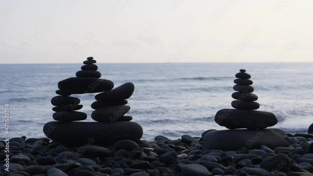 Rock stack balance and harmony on sea beach with evening ambient light, High quality 4k footage Rock stack balance and harmony on sea beach with evening ambient light, High quality 4k footage