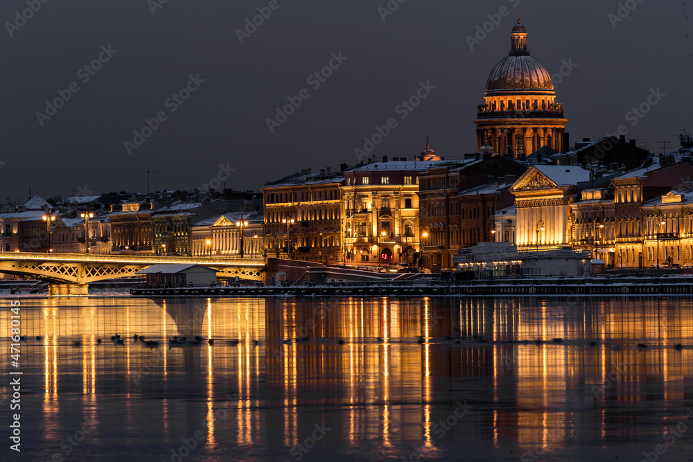 The panoramic footage of the winter night city Saint-Petersburg with picturesque reflection on water, Isaac cathedral on background, Blagoveshchensky bridge, old name is the lieutenant Schmidt