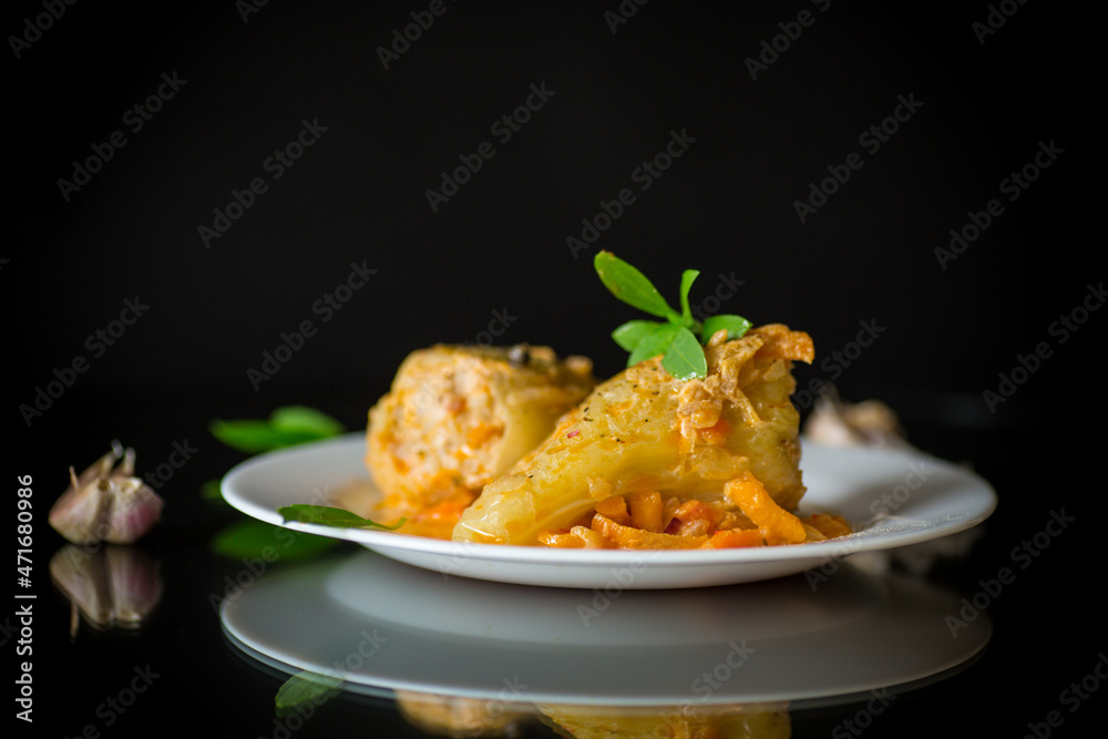 stewed peppers in gravy stuffed with meat and rice in a plate stewed peppers in gravy stuffed with meat and rice in a plate