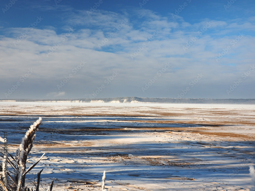 One winter frosty morning. Bank of the river. The river was covered with ice. Winter. Russia, Ural, Perm region.