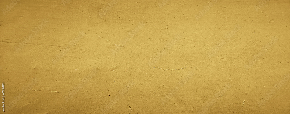 Obraz premium dark yellow concrete wall texture background, panoramic background