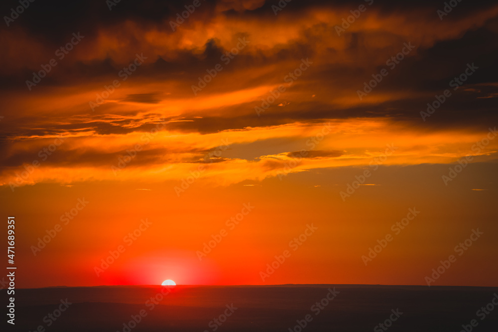 Panoramic shot of a landscape, orange sunset in the water of the sea, ocean with lush clouds, clouds to replace the background wall and model