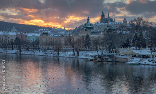 winter sunset over the river and Prague Castle