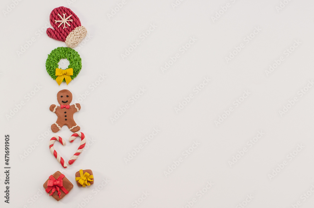 festive Christmas figurines made of plasticine on a white background with a place for text