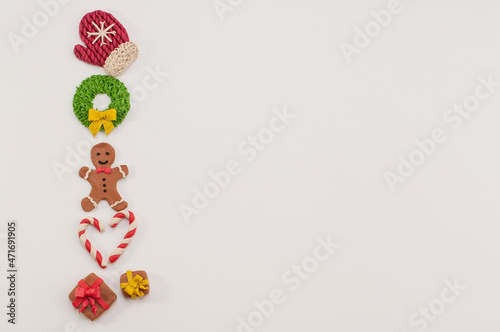festive Christmas figurines made of plasticine on a white background with a place for text