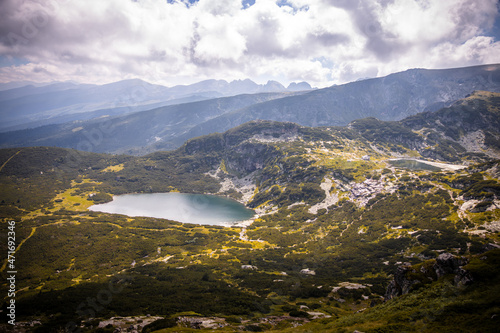 Beautiful landscape of the Seven Rila Lakes Bulgaria. Amazing nature shot  mountains and lake.Reflecting water on sunny cloudy day. High quality photo