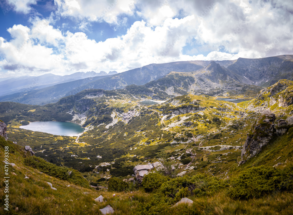 Fototapeta premium Beautiful landscape of the Seven Rila Lakes,Bulgaria. Amazing nature shot, mountains and lake.Reflecting water on sunny cloudy day. High quality photo