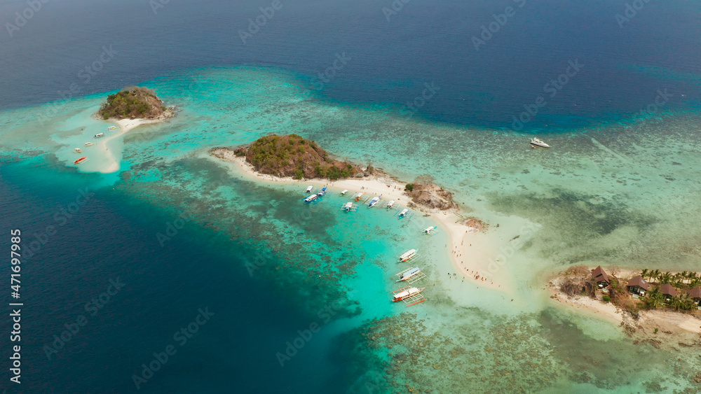 aerial view tropical island with sand white beach. Bulog Dos, Philippines, Palawan. Seascape bay with turquoise water and coral reef.