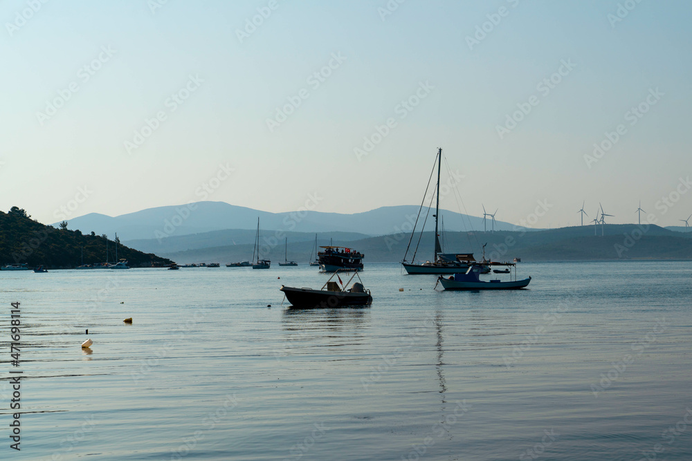 Panoramic view of town Sigacik with boats and sea.