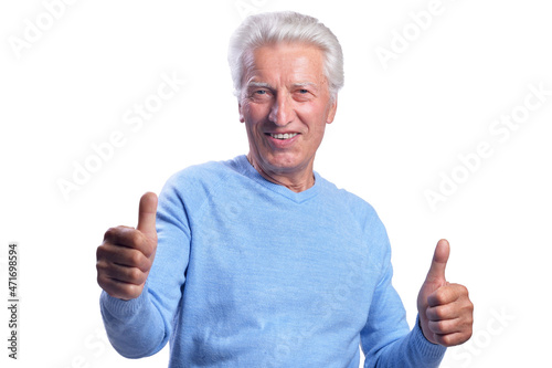 Happy senior man showing thumbs up on white background