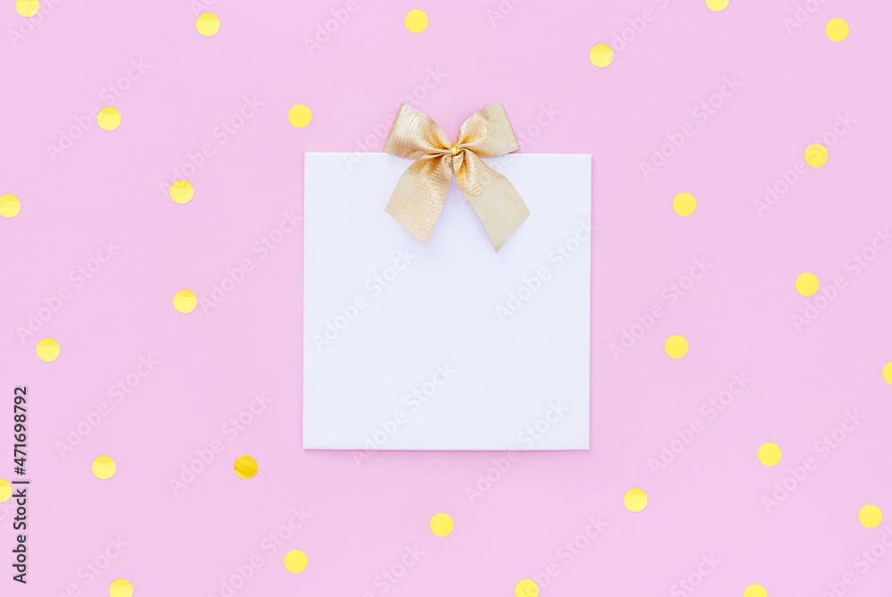 blank letterhead greeting card with gold sequins on pastel pink background with place for text