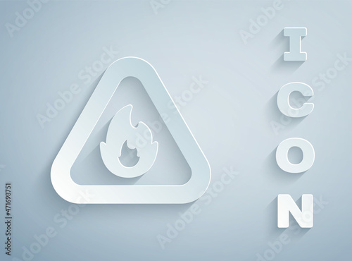 Paper cut Fire flame in triangle icon isolated on grey background. Warning sign of flammable product. Paper art style. Vector