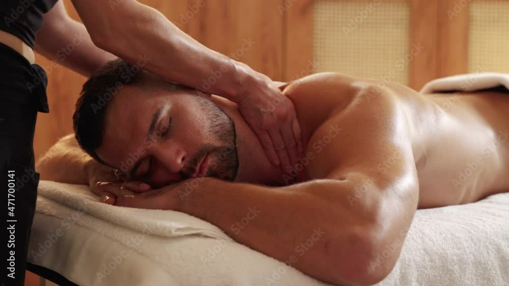 Close-up on a man receiving thai massage