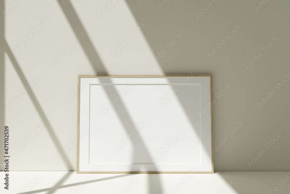Horizontal wooden photo frames mockup on the floor leaning against the room wall with shadow Horizontal wooden photo frames mockup on the floor leaning against the room wall with shadow