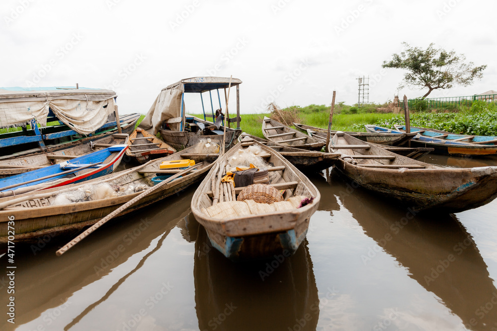 Pirogues or boats on Lake Nokoue parked at market for the day in Benin, Africa. 