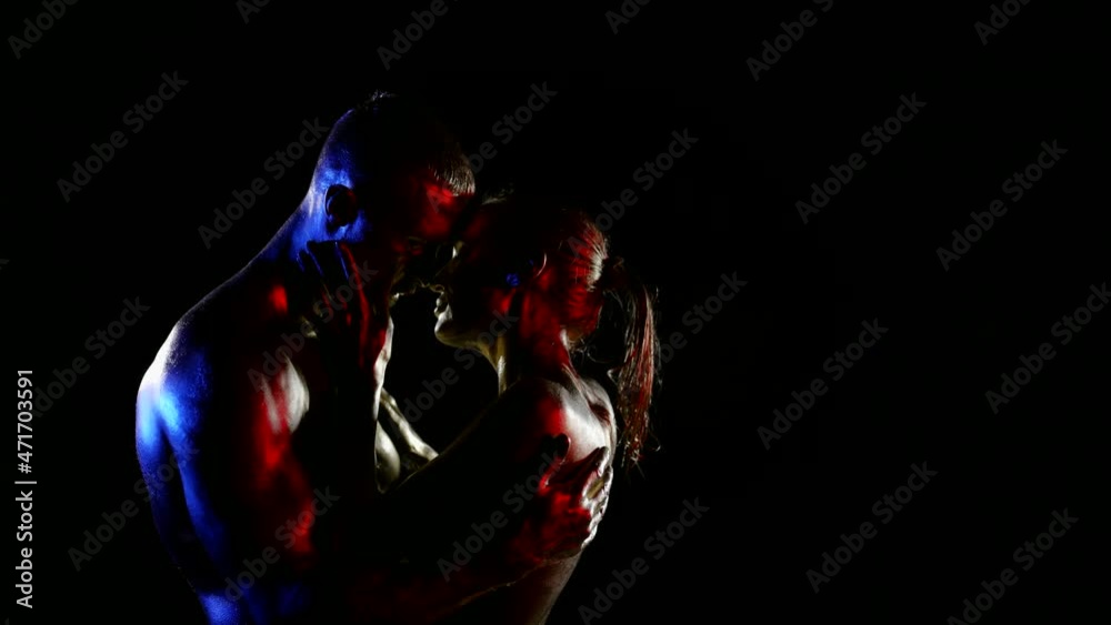 attractive bodies of young man and woman in darkness, embrace of sexy lovers and caress attractive bodies of young man and woman in darkness, embrace of sexy lovers and caress