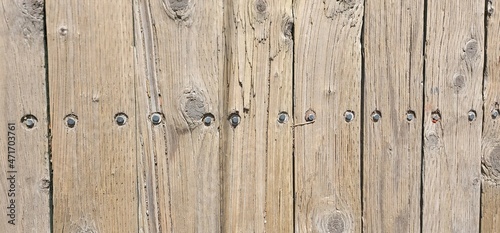 Backgrounds and textures; wooden planks with nails, old wood, place for an inscription.