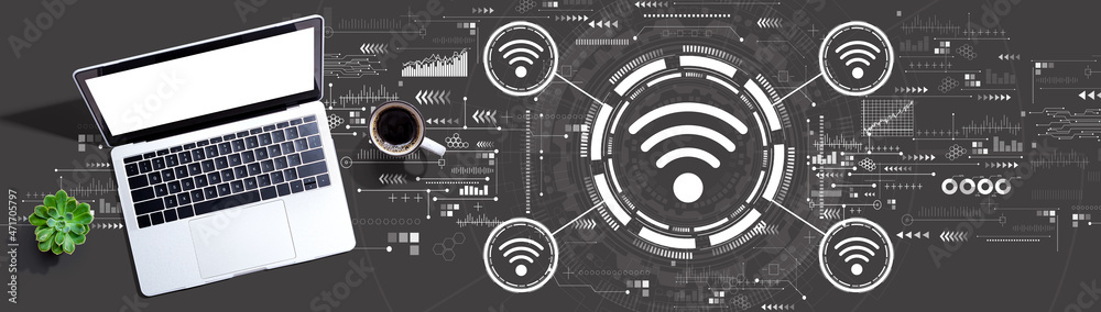 Wifi theme with a laptop computer on a desk Wifi theme with a laptop computer on a desk