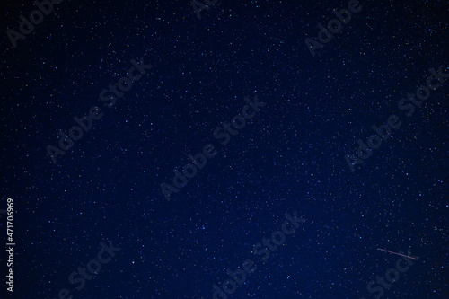 Night starry sky with stars, constellations, nebulae and galaxies at night. Abstract dark blue background