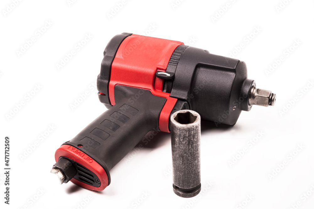 tools, impact pneumatics for unscrewing nuts in the car. on a white background. the color is red tools, impact pneumatics for unscrewing nuts in the car. on a white background. the color is red
