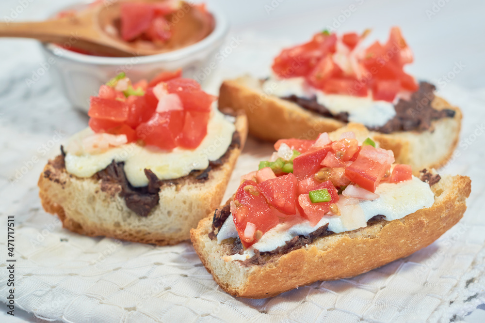 Traditional Mexican breakfast of molletes served. Traditional Mexican breakfast of molletes served.