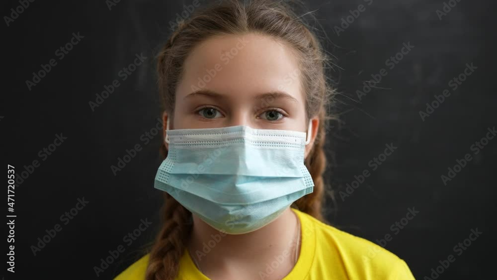 Girl in protective mask. Child face in safety mask. Prevention of diseases by virus. Portrait of girl in protective mask. Schoolgirl in medical mask. Close-up of child face. Fighting virus at school Girl in protective mask. Child face in safety mask. Prevention of diseases by virus. Portrait of girl in protective mask. Schoolgirl in medical mask. Close-up of child face. Fighting virus at school