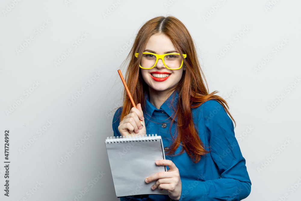 business woman with notepad and pencil wearing yellow glasses office professional