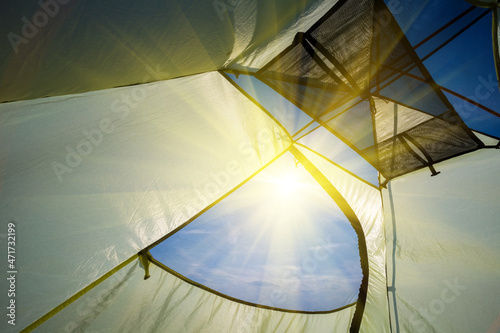 view from touristic tent to sky with sparkle sun  natural travel background