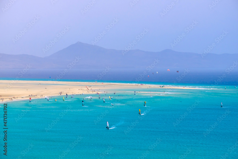 Aerial view of Sotavento beach with sailboats during the World Championship on the Canary Island of Fuerteventura. Aerial view of Sotavento beach with sailboats during the World Championship on the Canary Island of Fuerteventura.