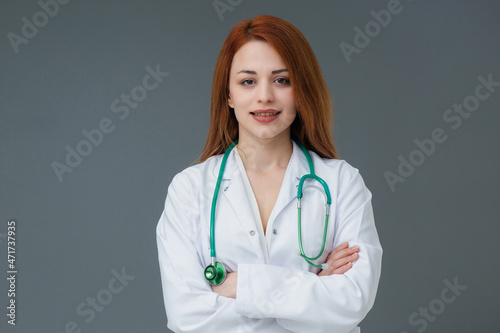 Beautiful smiling Turkish young doctor woman portrait. She is confident mood.