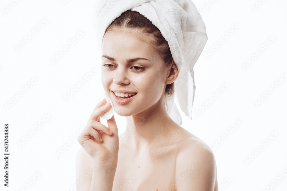 cheerful woman with a white towel on her head face cream skin care cheerful woman with a white towel on her head face cream skin care