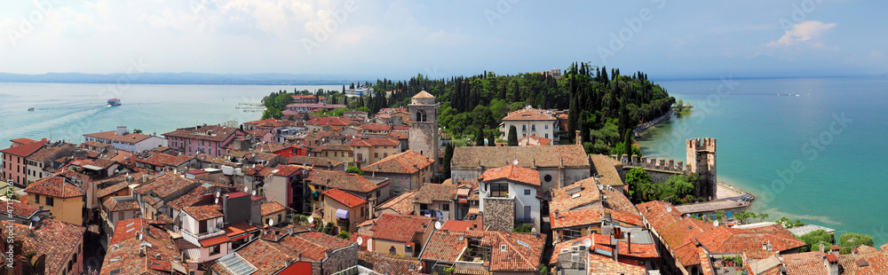 View From Scaligero Castle To The Old Town Of Sirmione At Lake Garda In Italy On A Beautiful Spring Day With A Blue Sky And A Few Clouds