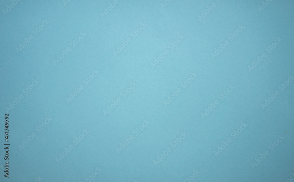 A blank blue sheet of paper. Space for text on a blue background. The color of the sea wave.The shade of the sea breeze