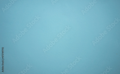 A blank blue sheet of paper. Space for text on a blue background. The color of the sea wave.The shade of the sea breeze
