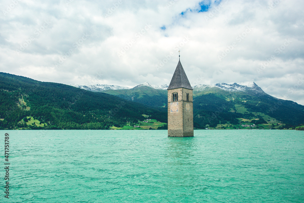 Church tower in blue lake 