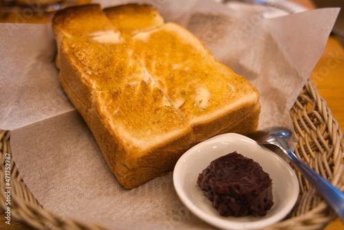 Kyoto,Japan - November 22, 2021: Closeup of buttered slice of toast and sweet bean jam
