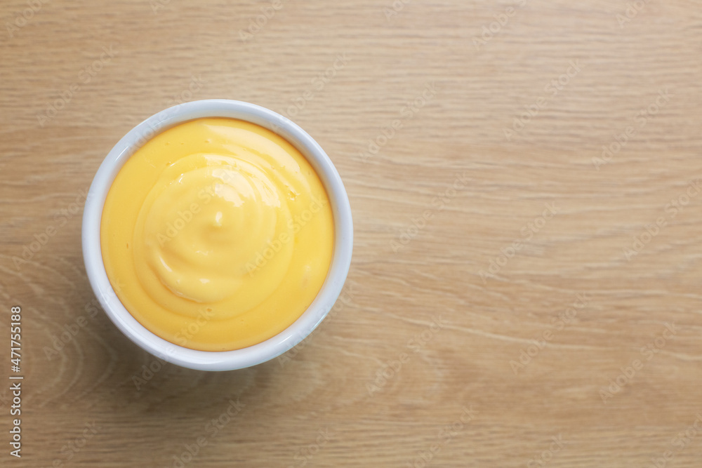 Homemade mayonnaise prepared with eggs and oil, top view Homemade mayonnaise prepared with eggs and oil, top view