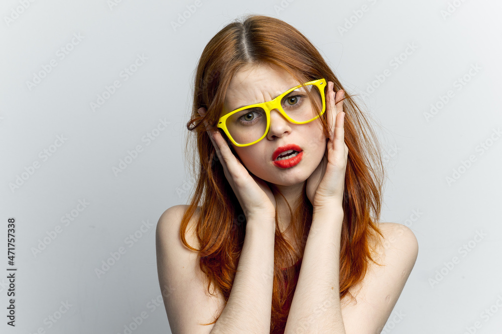 pretty woman yellow glasses and red lips fashion light background pretty woman yellow glasses and red lips fashion light background