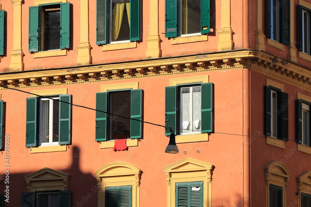 Colorful Trastevere Building Facade with Hanging Laundry Close Up in Rome, Italy
