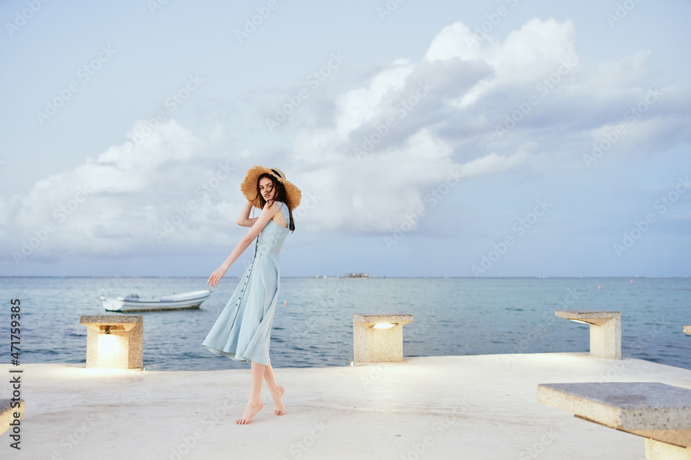 woman in dress near ocean beach summer lifestyle leisure