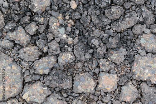 Crushed asphalt. Stones and pieces of asphalt for backdrop.