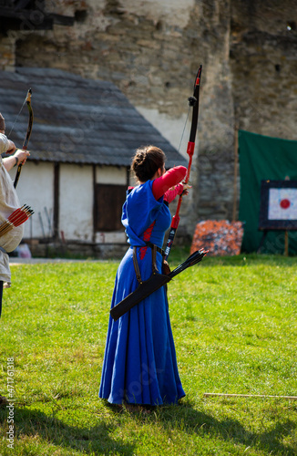 Medieval archers with bows on the territory of the castle